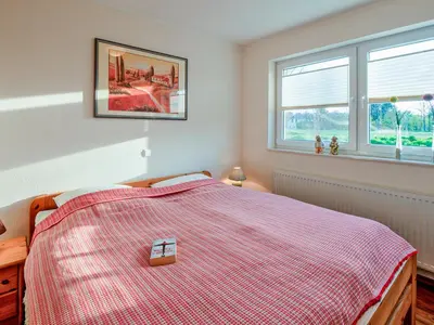 Ein Bett oder Betten in einem Zimmer der Unterkunft Haus Regenbogen Fewo Nr 2
