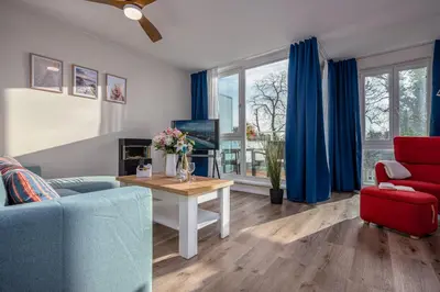 Ein Sitzbereich in der Unterkunft Luv & Lee BalticLoft - 150m zum Strand mit Sauna, Kamin, Balkon