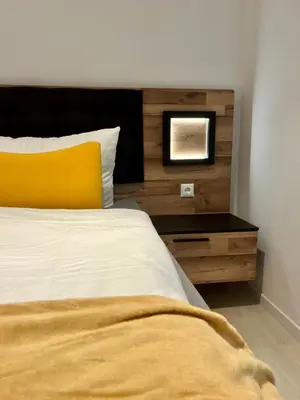 Ein Bett oder Betten in einem Zimmer der Unterkunft Wiesenau 1 Ferienwohnung in Prerow by Restaurant Wiesenau