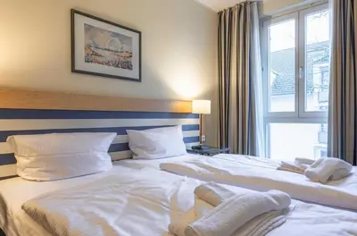 Ein Bett oder Betten in einem Zimmer der Unterkunft Ferienwohnung Deichperle - Ihr idyllischer Rückzugsort an der Ostsee in Zingst