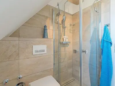 Ein Badezimmer in der Unterkunft House on the beach 5