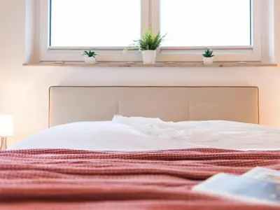 Ein Bett oder Betten in einem Zimmer der Unterkunft Beach House Lindenstrasse