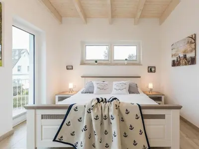 Ein Bett oder Betten in einem Zimmer der Unterkunft Beach House Lindenstrasse