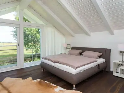 Ein Bett oder Betten in einem Zimmer der Unterkunft Holiday Home Fünfjahreszeiten in Bodstedt by Interhome