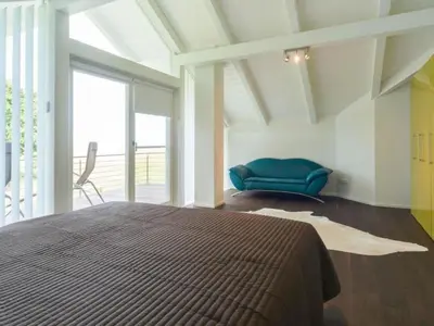 Ein Bett oder Betten in einem Zimmer der Unterkunft Holiday Home Fünfjahreszeiten in Bodstedt by Interhome