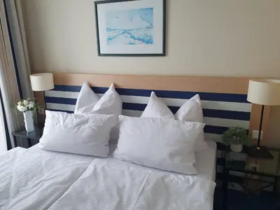 Ein Bett oder Betten in einem Zimmer der Unterkunft Am Zingster Strand