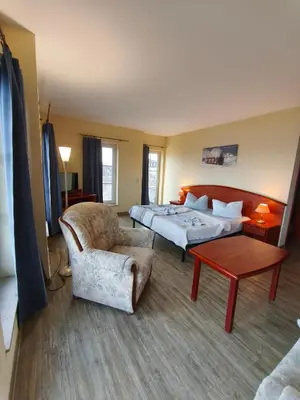 Ein Bett oder Betten in einem Zimmer der Unterkunft Pension Hafenblick
