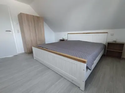 Ein Bett oder Betten in einem Zimmer der Unterkunft Ferienhaus Ostseebrise