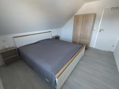 Ein Bett oder Betten in einem Zimmer der Unterkunft Ferienhaus Ostseebrise