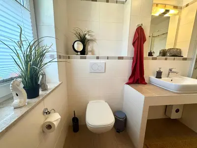 Ein Badezimmer in der Unterkunft KÄPT´N BRASS 