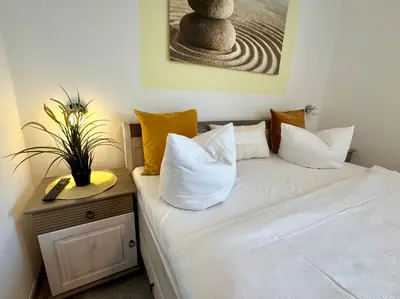 Ein Bett oder Betten in einem Zimmer der Unterkunft KÄPT´N BRASS 