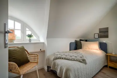 Ein Bett oder Betten in einem Zimmer der Unterkunft Wiesenwind