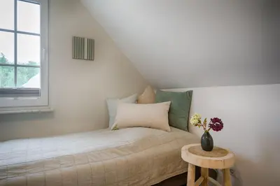 Ein Bett oder Betten in einem Zimmer der Unterkunft Wiesenwind