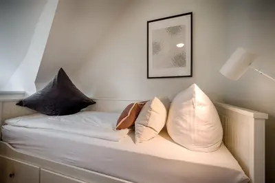 Ein Bett oder Betten in einem Zimmer der Unterkunft Hafenbrise