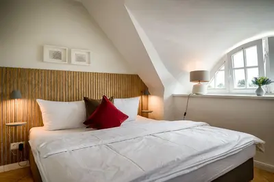Ein Bett oder Betten in einem Zimmer der Unterkunft Hafenbrise