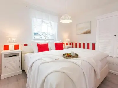 Ein Bett oder Betten in einem Zimmer der Unterkunft Villa Strandblick 5