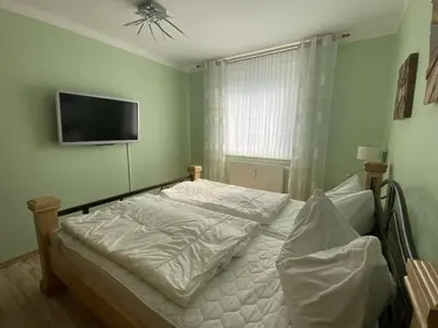 Ein Bett oder Betten in einem Zimmer der Unterkunft Holiday apartment, holiday home on the beach - pure relaxation