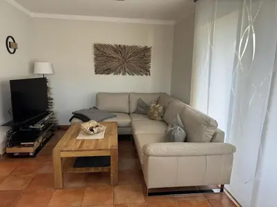 Ein Sitzbereich in der Unterkunft Holiday apartment, holiday home on the beach - pure relaxation