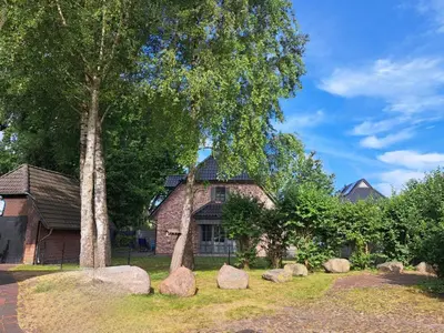 Ein Garten an der Unterkunft Lilly s Beachhouse