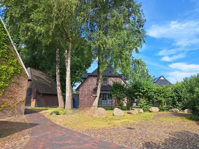 Ein Garten an der Unterkunft Lilly s Beachhouse