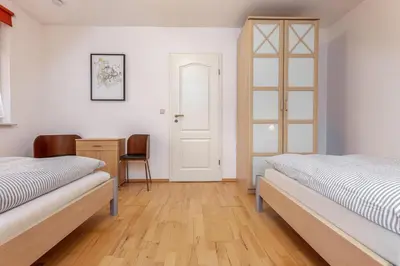 Ein Bett oder Betten in einem Zimmer der Unterkunft Schulstrasse 66b Cubes Insel