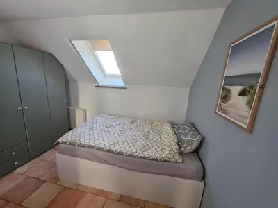 Ein Bett oder Betten in einem Zimmer der Unterkunft Fewo LucGa