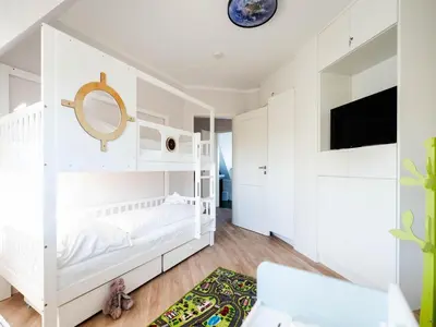 Ein Bett oder Betten in einem Zimmer der Unterkunft Ferienhaus Haubenlerche, Fuhlendorf