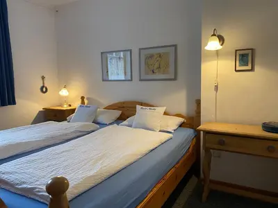 Ein Bett oder Betten in einem Zimmer der Unterkunft Ferienwohnanlage Nowo Ferienwohnungen Nowo Whg 04