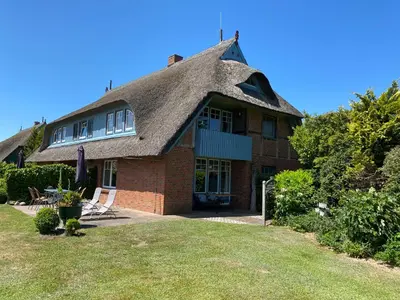 Ein Garten an der Unterkunft Ferienwohnanlage Nowo Ferienwohnungen Nowo Whg 02