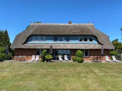 Ein Garten an der Unterkunft Ferienwohnanlage Nowo Ferienwohnungen Nowo Whg 01