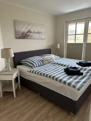 Ein Bett oder Betten in einem Zimmer der Unterkunft Idyllisches Reethaus in Strandnähe mit Comfort