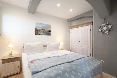 Ein Bett oder Betten in einem Zimmer der Unterkunft Apartment Hafenflair