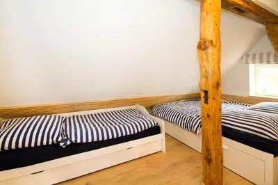 Ein Bett oder Betten in einem Zimmer der Unterkunft Kapitänsdeck