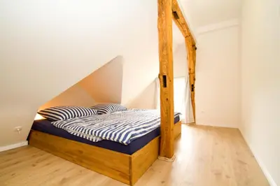 Ein Bett oder Betten in einem Zimmer der Unterkunft Kapitänsdeck
