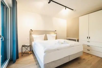 Ein Bett oder Betten in einem Zimmer der Unterkunft Strandvilla Zingst Appartement 08 1 OG