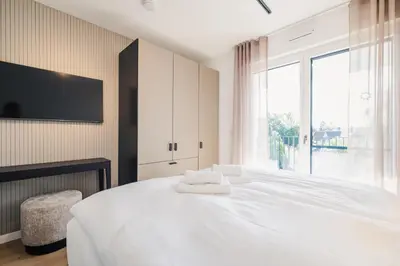 Ein Bett oder Betten in einem Zimmer der Unterkunft Strandvilla Zingst Appartement 15 2 OG