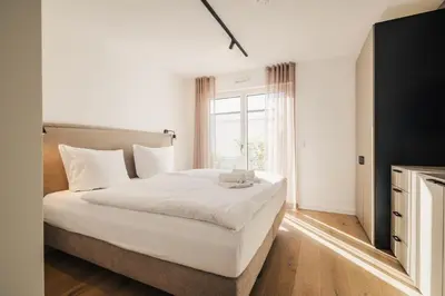 Ein Bett oder Betten in einem Zimmer der Unterkunft Strandvilla Zingst Appartement 04 EG