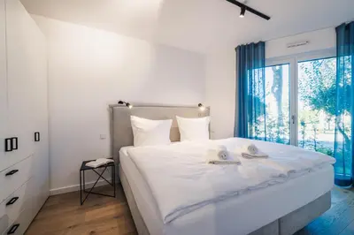 Ein Bett oder Betten in einem Zimmer der Unterkunft Strandvilla Zingst Appartement 01 EG