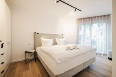 Ein Bett oder Betten in einem Zimmer der Unterkunft Strandvilla Zingst Appartement 06 1 OG