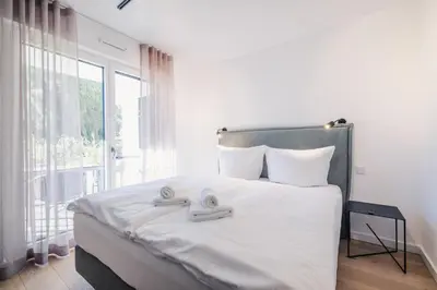 Ein Bett oder Betten in einem Zimmer der Unterkunft Strandvilla Zingst Appartement 05 EG