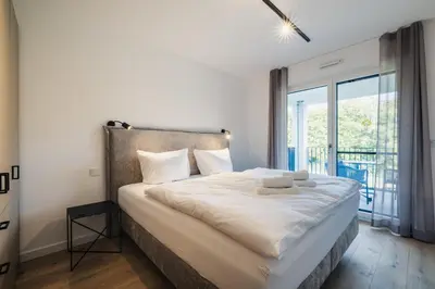 Ein Bett oder Betten in einem Zimmer der Unterkunft Strandvilla Zingst Appartement 12 2 OG