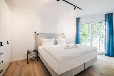 Ein Bett oder Betten in einem Zimmer der Unterkunft Strandvilla Zingst Appartement 11 2 OG