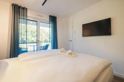 Ein Bett oder Betten in einem Zimmer der Unterkunft Strandvilla Zingst Appartement 07 1 OG