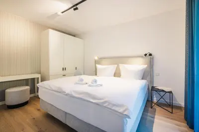 Ein Bett oder Betten in einem Zimmer der Unterkunft Strandvilla Zingst Appartement 02 EG