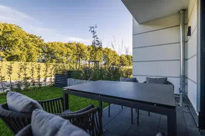 Ein Garten an der Unterkunft Strandvilla Zingst Appartement 02 EG