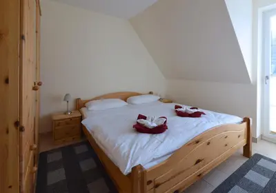 Ein Bett oder Betten in einem Zimmer der Unterkunft Ferienwohnung „Hürsch“