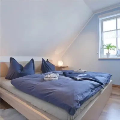 Ein Bett oder Betten in einem Zimmer der Unterkunft Boddentraum