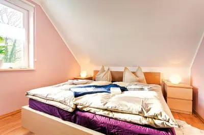 Ein Bett oder Betten in einem Zimmer der Unterkunft Boddentraum