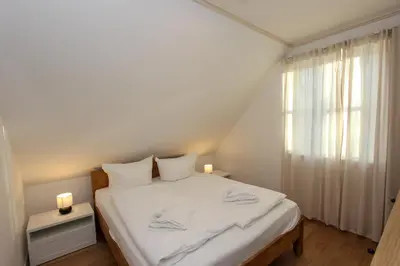 Ein Bett oder Betten in einem Zimmer der Unterkunft Ilse
