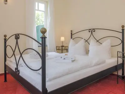Ein Bett oder Betten in einem Zimmer der Unterkunft Burg Roland Wohnung 02